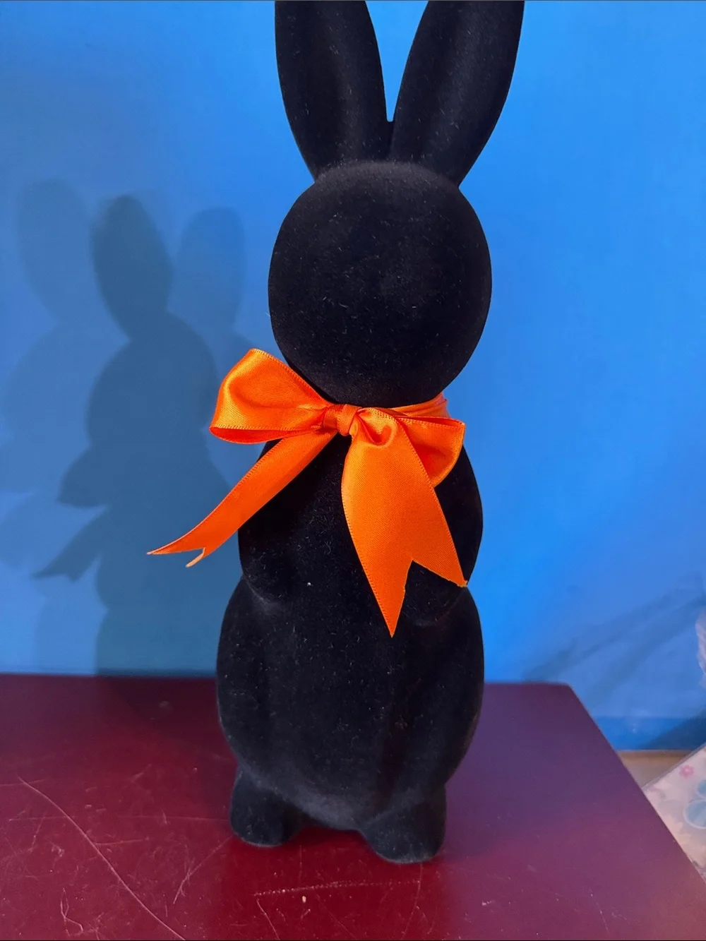 Black flocked (fuzzy) bunny figurine w/orange bow contemporary Easter- NEW